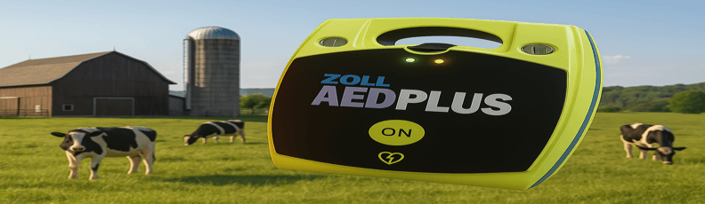 farm-zoll-aed-plus-on-uk-rural-farm-defibsupplies-blog-banner.png ZOLL AED Plus defibrillator in a rural UK farm setting with cows and a barn in the background